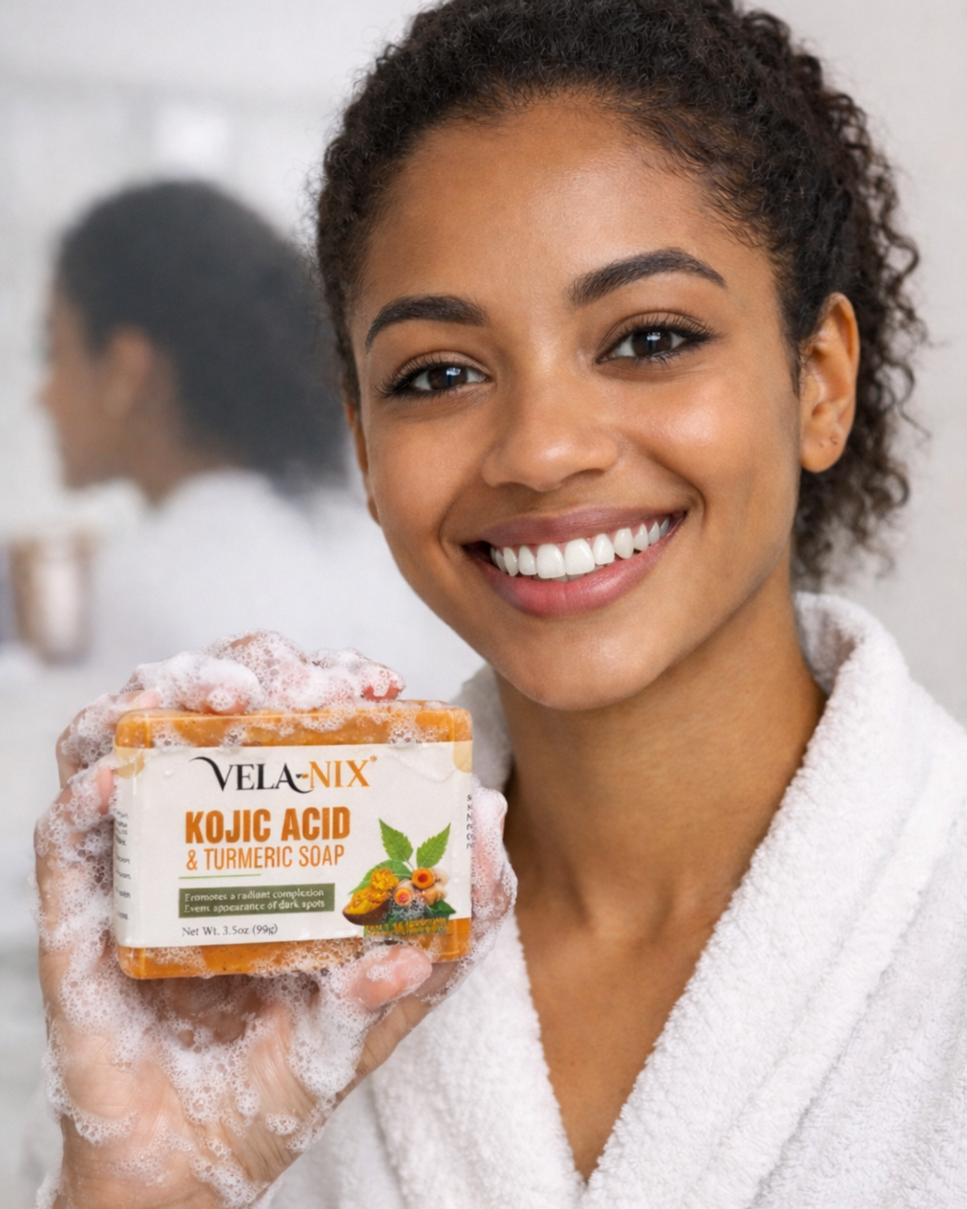 Woman using VELA-NIX Kojic Acid & Turmeric Soap with rich lather to cleanse and brighten skin

